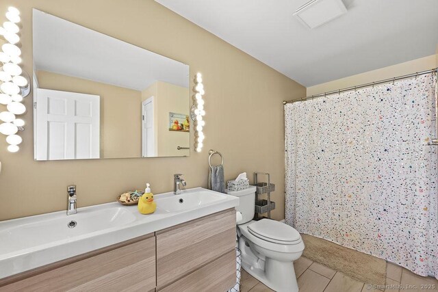 14 Stakey Farm Rd, Southington, CT 06489 - bathroom with toilet, double vanity, tile patterned floors, and a shower with shower curtain