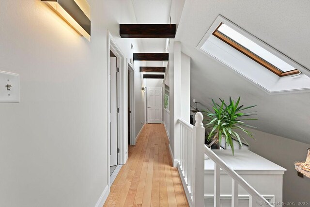 14 Stakey Farm Rd, Southington, CT 06489 - hallway featuring a skylight, light wood-type flooring, and an upstairs landing