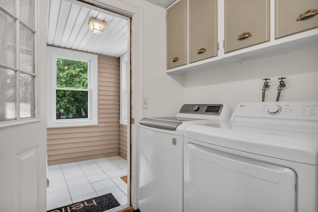 9 Florence St, East Haven, CT 06513 - laundry area featuring cabinet space, washer and clothes dryer, and tile patterned floors