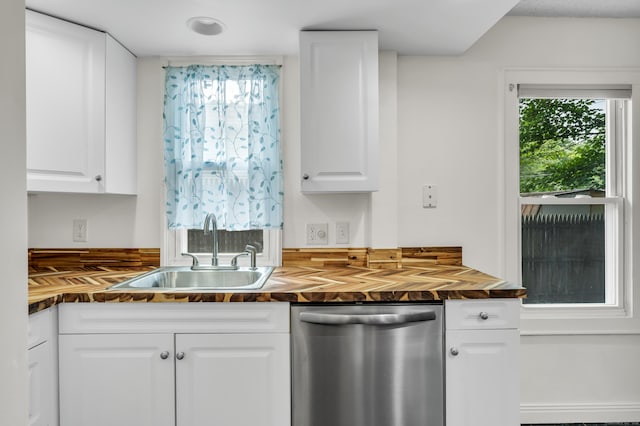 9 Florence St, East Haven, CT 06513 - kitchen with butcher block countertops, stainless steel dishwasher, a sink, and white cabinets