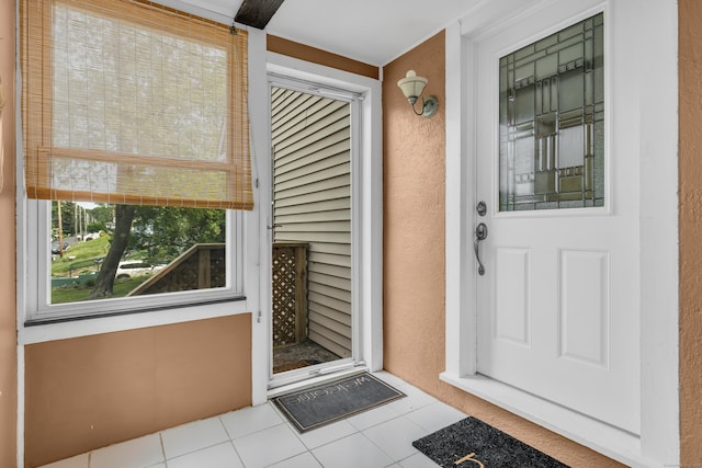 9 Florence St, East Haven, CT 06513 - doorway to property featuring stucco siding