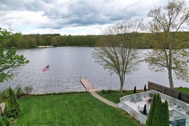 water view featuring a boat dock and a forest