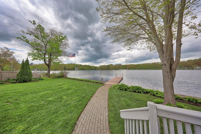 water view with a boat dock and fence