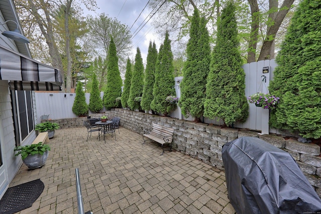 view of patio with outdoor dining space and area for grilling