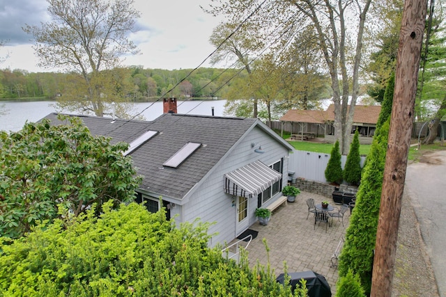 aerial view of a nearby body of water and a heavily wooded area