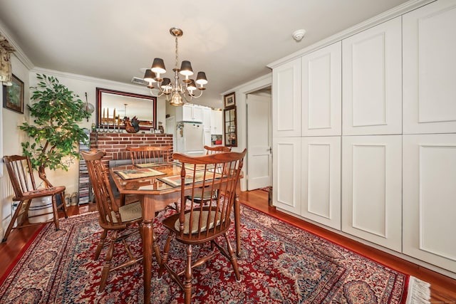 dining room featuring a chandelier and wood finished floors