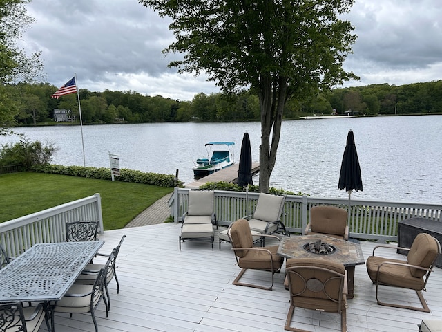 59 Bethlehem Ln, Bethlehem, CT 06751 - wooden deck with an outdoor fire pit, a water view, a yard, and a view of trees