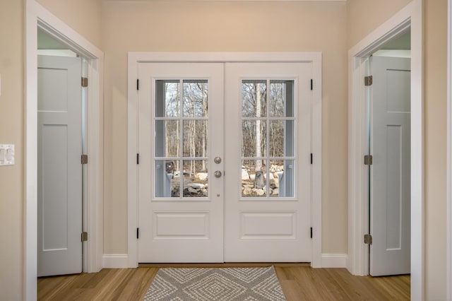 40 Allyn St, Groton, CT 06355 - doorway featuring light wood-style flooring and baseboards