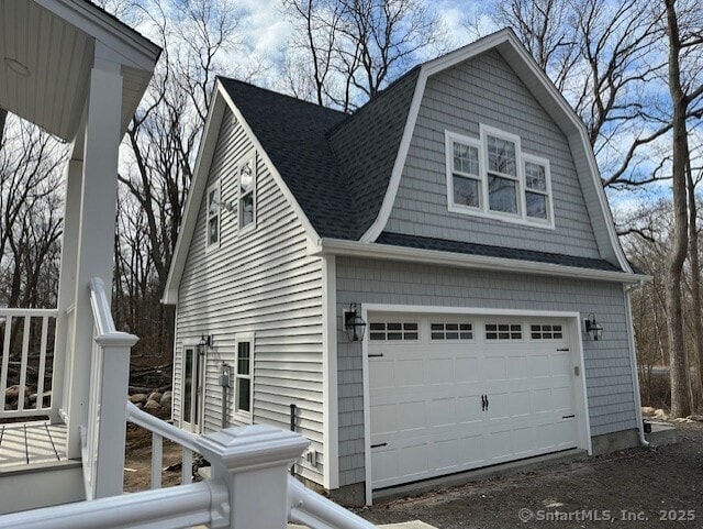 40 Allyn St, Groton, CT 06355 - view of home's exterior featuring a shingled roof, a gambrel roof, and an attached garage