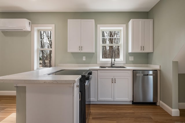 40 Allyn St, Groton, CT 06355 - kitchen with dishwasher, electric range oven, a wall mounted air conditioner, a sink, and light wood finished floors