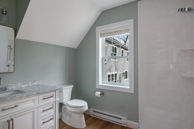 40 Allyn St, Groton, CT 06355 - bathroom featuring a baseboard radiator, wood finished floors, vaulted ceiling, toilet, and vanity