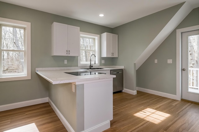 40 Allyn St, Groton, CT 06355 - kitchen with dishwasher, a sink, light wood-style floors, white cabinets, and recessed lighting