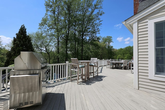 110 Nursery Rd, Ridgefield, CT 06877 - deck with outdoor dining space, a grill, and view of wooded area