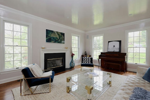 110 Nursery Rd, Ridgefield, CT 06877 - living area with healthy amount of natural light, wood finished floors, baseboards, and ornamental molding
