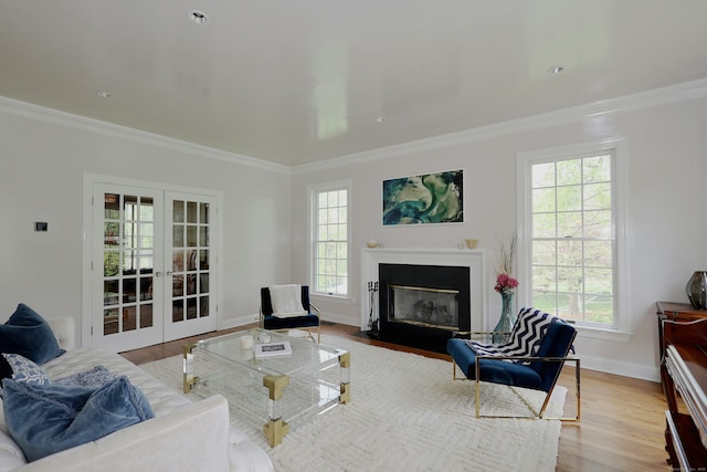110 Nursery Rd, Ridgefield, CT 06877 - living area with french doors, healthy amount of natural light, wood finished floors, and crown molding