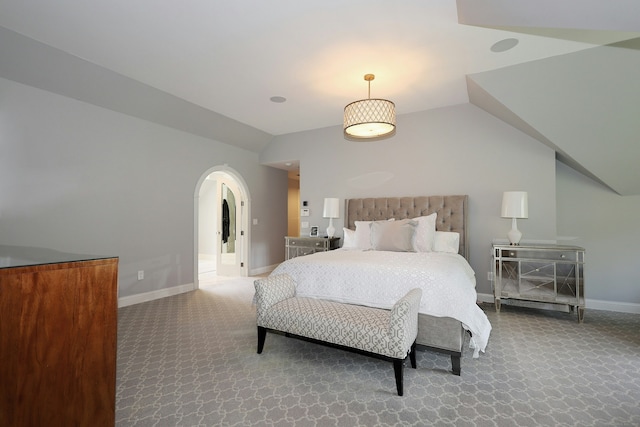 110 Nursery Rd, Ridgefield, CT 06877 - carpeted bedroom with arched walkways, vaulted ceiling, and baseboards