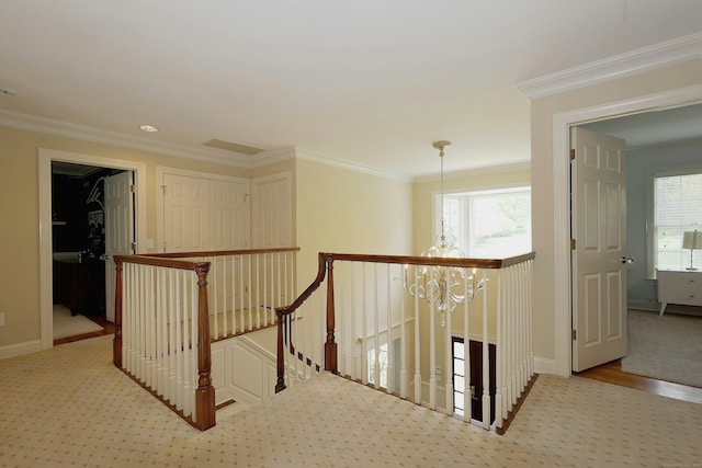 110 Nursery Rd, Ridgefield, CT 06877 - hall with an upstairs landing, a chandelier, plenty of natural light, ornamental molding, and baseboards