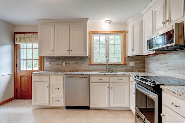 21 Summit Farms Rd, Southington, CT 06489 - kitchen with stainless steel appliances, a sink, tasteful backsplash, and light stone countertops