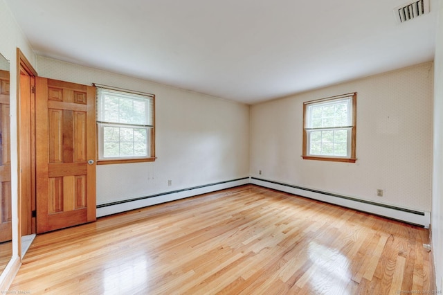 21 Summit Farms Rd, Southington, CT 06489 - empty room with light wood-style flooring and a baseboard radiator