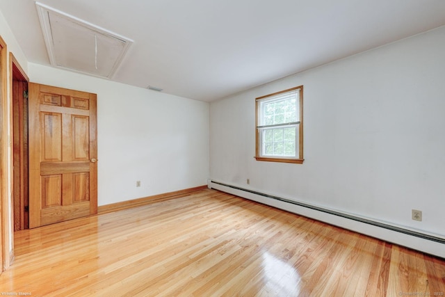 21 Summit Farms Rd, Southington, CT 06489 - unfurnished room with attic access, a baseboard heating unit, light wood finished floors, and baseboards