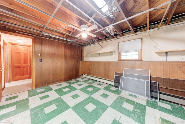 21 Summit Farms Rd, Southington, CT 06489 - below grade area with a baseboard radiator, wooden walls, tile patterned floors, and wainscoting