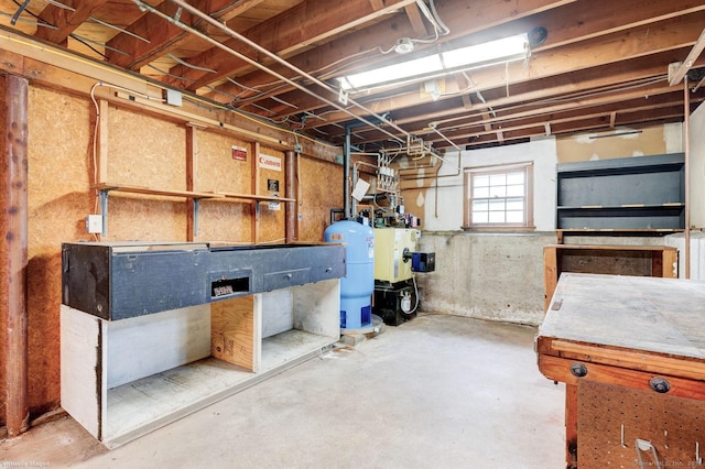 21 Summit Farms Rd, Southington, CT 06489 - below grade area featuring a water pressure tank and a workshop area