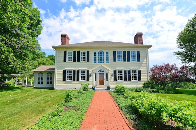 175 Pulpit Rock Rd, Woodstock, CT 06281 - colonial-style house featuring a chimney and a front yard