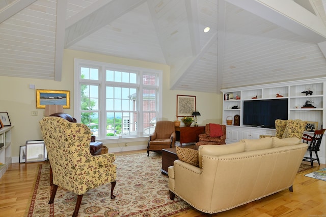 175 Pulpit Rock Rd, Woodstock, CT 06281 - living area featuring light wood-style flooring, beam ceiling, high vaulted ceiling, and baseboards