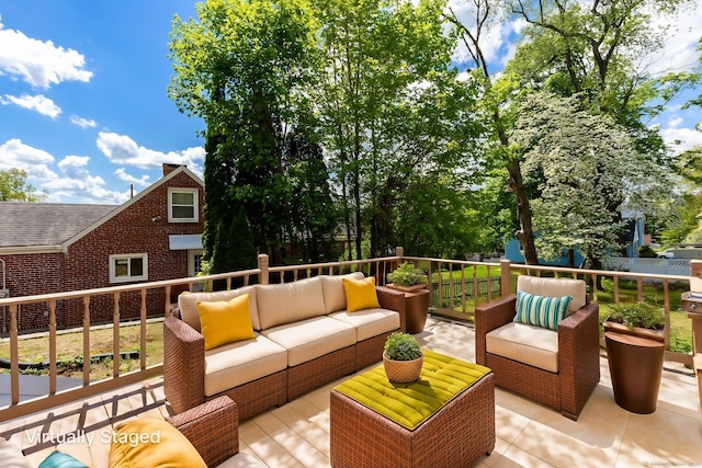 wooden terrace with outdoor lounge area