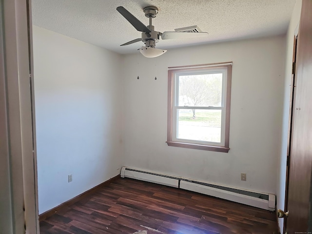 30 Huntley Rd, Killingly, CT 06241 - unfurnished room featuring a baseboard radiator, dark wood finished floors, a textured ceiling, and a ceiling fan