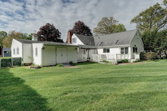 39 Eastgate Ln, Enfield, CT 06082 - back of house with a deck and a chimney