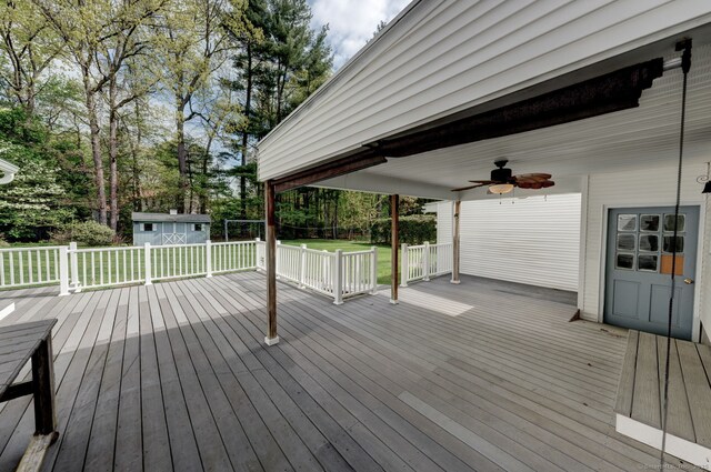 39 Eastgate Ln, Enfield, CT 06082 - wooden terrace featuring a ceiling fan, an outdoor structure, a yard, view of scattered trees, and a shed