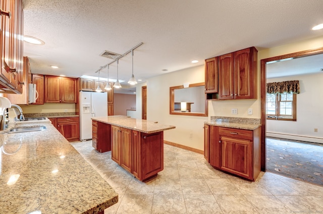 39 Eastgate Ln, Enfield, CT 06082 - kitchen featuring white appliances, a sink, a baseboard heating unit, a textured ceiling, and track lighting