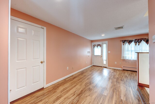 39 Eastgate Ln, Enfield, CT 06082 - entryway with baseboard heating, baseboards, and light wood finished floors