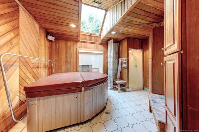 39 Eastgate Ln, Enfield, CT 06082 - miscellaneous room with a skylight, wood walls, and wooden ceiling