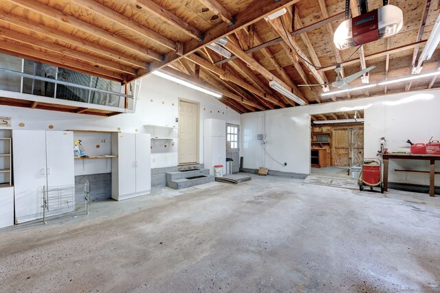 39 Eastgate Ln, Enfield, CT 06082 - garage featuring a garage door opener and a workshop area