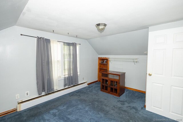bonus room with a baseboard radiator, vaulted ceiling, carpet flooring, and baseboards