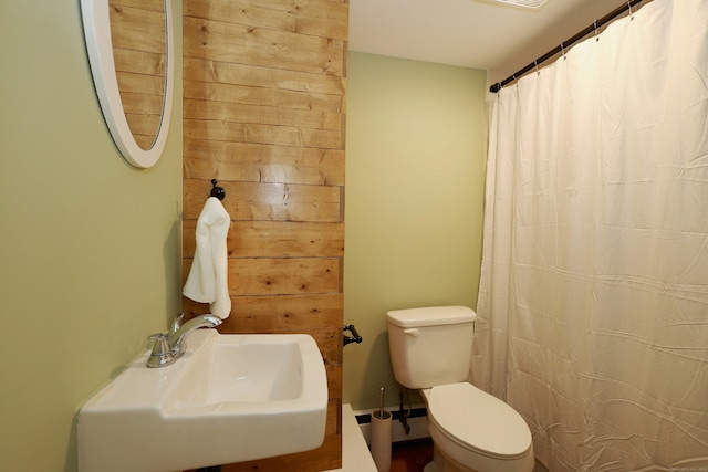 42 Wilridge Rd, Ridgefield, CT 06877 - full bath with a sink, toilet, a shower with shower curtain, and a baseboard heating unit
