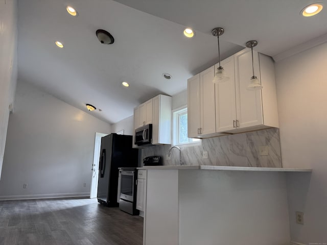 39 Medford St, West Haven, CT 06516 - kitchen with appliances with stainless steel finishes, dark wood-style flooring, tasteful backsplash, white cabinetry, and vaulted ceiling
