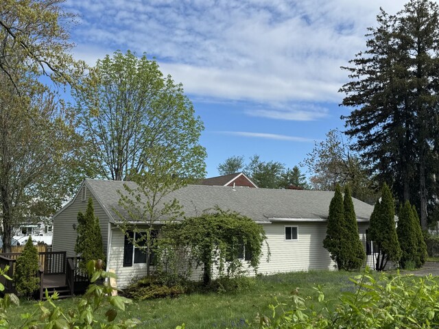 39 Medford St, West Haven, CT 06516 - view of side of home featuring a wooden deck and roof with shingles