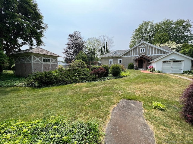 view of front of home featuring an attached garage and a front yard