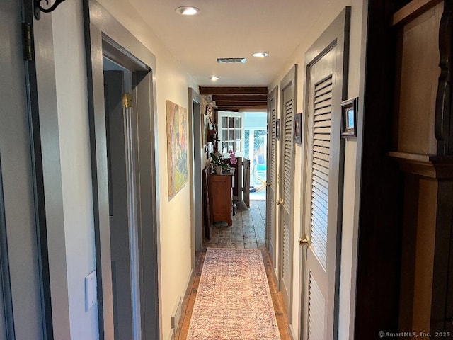 hall with recessed lighting and light wood-type flooring