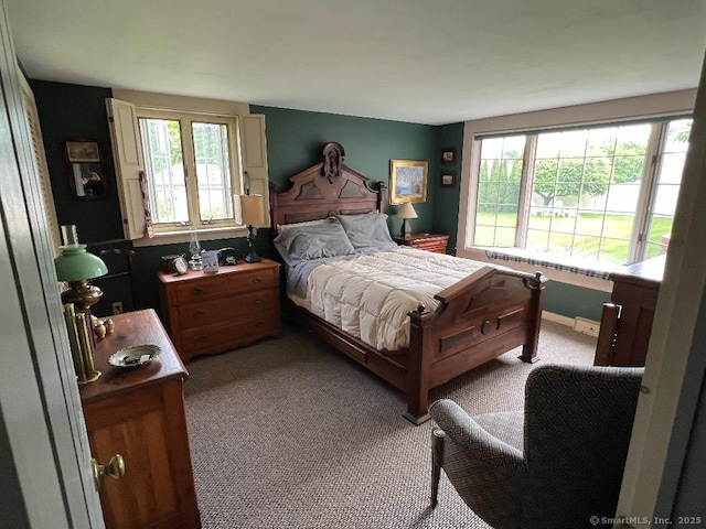 bedroom with carpet and baseboards