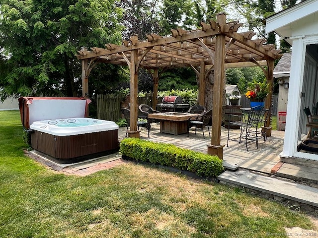 view of yard featuring a hot tub, central AC, a patio area, and a pergola