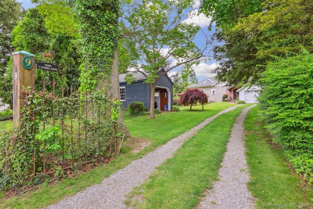 9 Columbus Ave, East Lyme, CT 06357 - view of green lawn featuring driveway and an outdoor structure