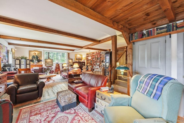 9 Columbus Ave, East Lyme, CT 06357 - living room featuring beam ceiling, hardwood / wood-style floors, and stairway