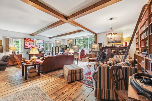9 Columbus Ave, East Lyme, CT 06357 - living room featuring beam ceiling and wood-type flooring