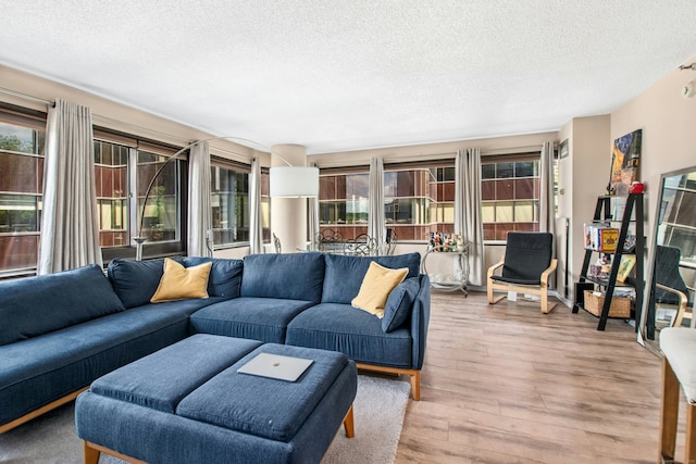 127 Greyrock Pl Unit 502, Stamford, CT 06901 - living room with a textured ceiling and wood finished floors