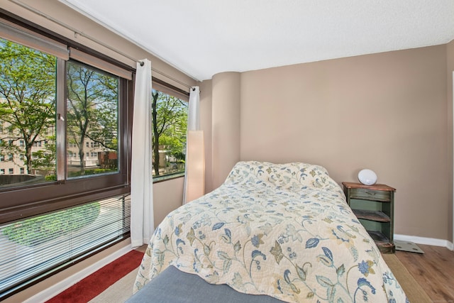 127 Greyrock Pl Unit 502, Stamford, CT 06901 - bedroom featuring baseboards and wood finished floors