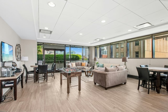 127 Greyrock Pl Unit 502, Stamford, CT 06901 - living room featuring wood finished floors, recessed lighting, expansive windows, and baseboards